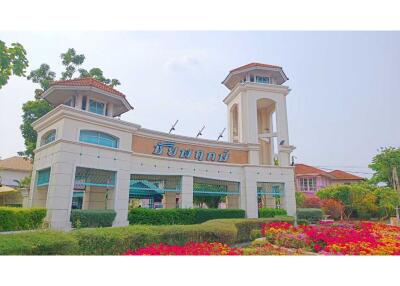 Front view of the main building with landscaped gardens