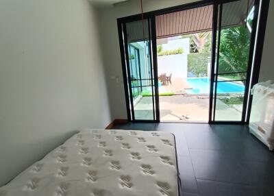 Bedroom with a view of the pool