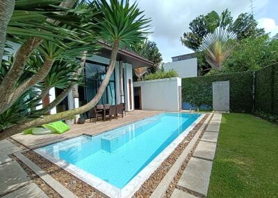 Beautiful outdoor space with a swimming pool and dining area