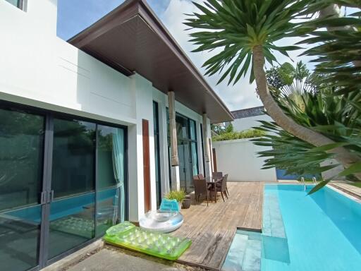 Modern house with a pool and patio area