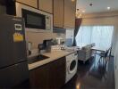 Modern kitchen area with integrated appliances