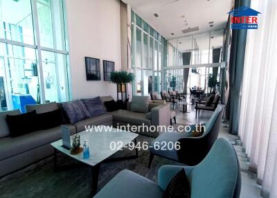 Modern living room with glass walls and comfortable seating