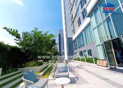 Outdoor seating area near a modern building