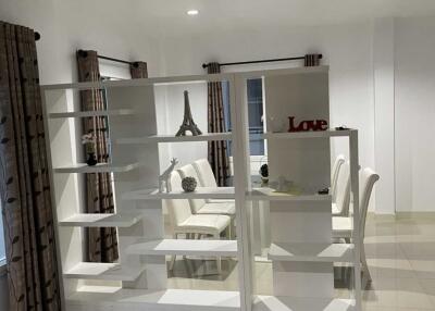 Modern dining room with bookshelf divider