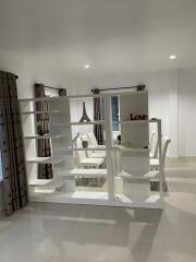 Modern dining room with bookshelf divider