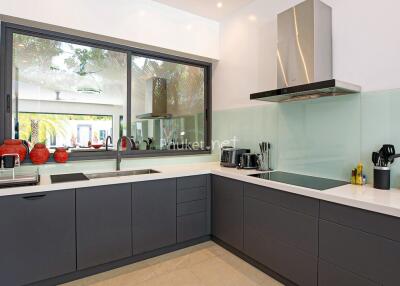 Modern kitchen with sleek cabinetry and appliances