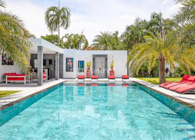 Modern outdoor pool area with lounge seating