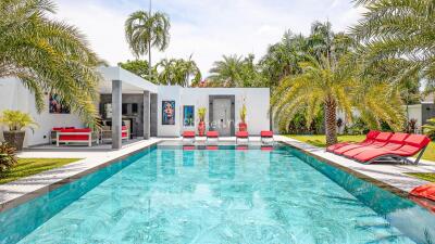 Modern outdoor pool area with lounge seating