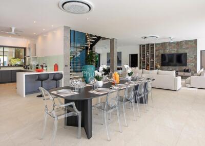 Spacious open-concept living area with modern kitchen, dining, and living room