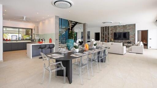 Spacious open-concept living area with modern kitchen, dining, and living room