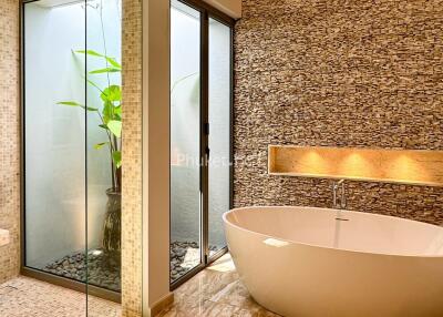 Modern bathroom with large soaking tub and natural light