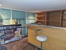 Home bar with stools and shelving