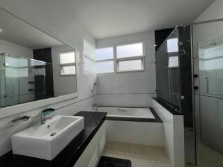 Modern bathroom with bathtub and shower