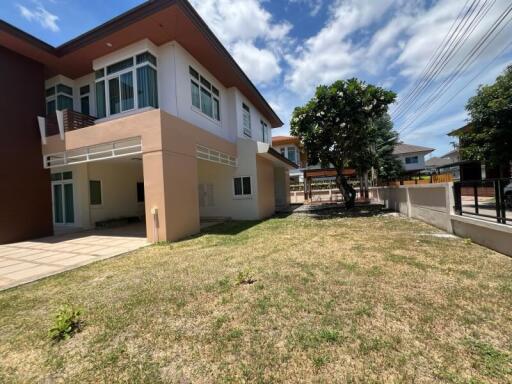 Two-story residential building with a yard