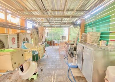 Spacious utility room with equipment and storage