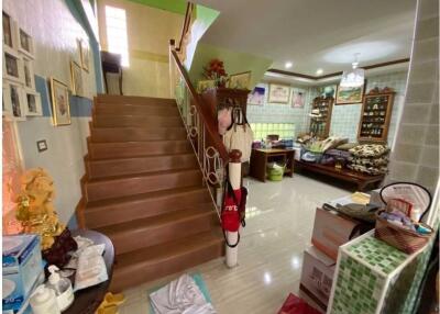 Living area with staircase and furniture