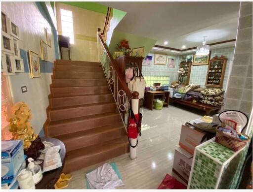 Living area with staircase and furniture