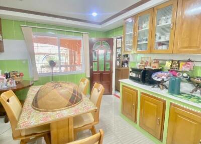 Spacious kitchen with wooden cabinetry