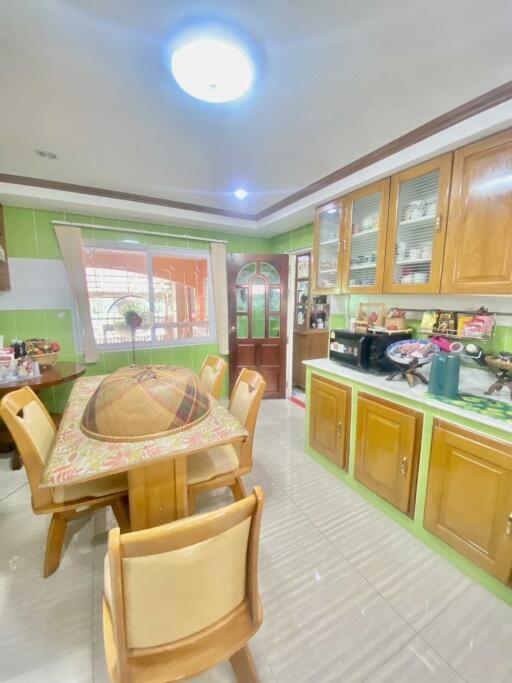 Spacious kitchen with wooden cabinetry