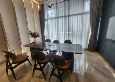 Modern dining room with a large table and stylish chairs