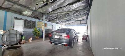 Covered garage with parked car