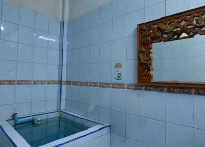 Traditional bathroom with ornate mirror