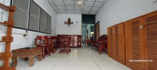 Living room with wooden furniture and tiled floor