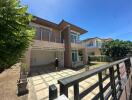 Modern two-story house with driveway and front yard