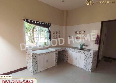 Bright kitchen with spacious countertops and large window