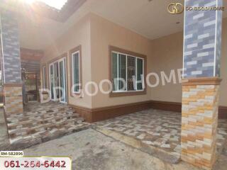 Front view of a house with tiled patio