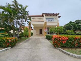 Two-story house with garden and driveway