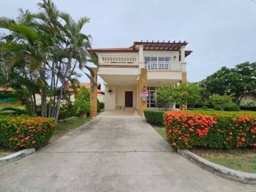 Two-story house with garden and driveway