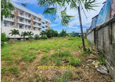 vacant land with building in background