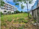 vacant land with building in background