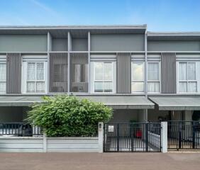 Two-story townhouse with front yard and driveway