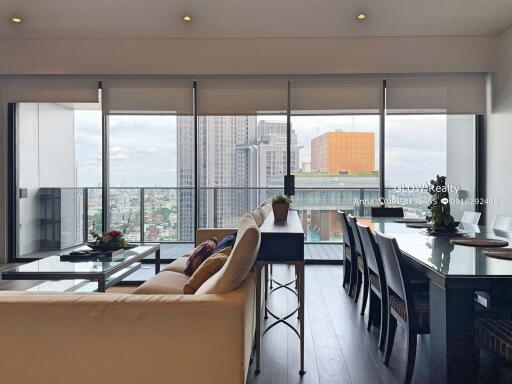 Modern living and dining area with city view