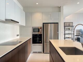 Modern kitchen with stainless steel appliances and white cabinetry