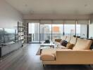 Spacious modern living room with large windows and city view