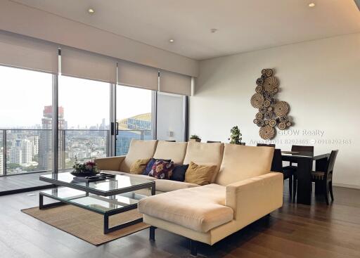 Modern living room with large windows and city view