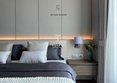 Modern bedroom with double bed and side table