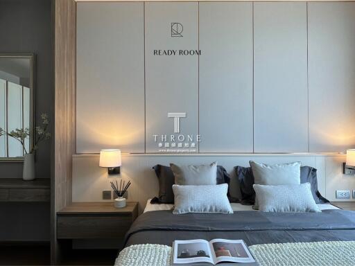 Modern bedroom with bedside lamps and a neatly made bed