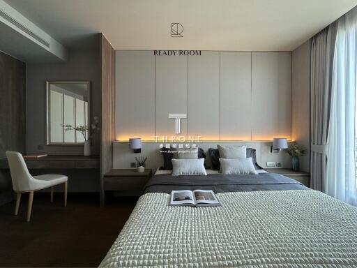 Modern bedroom with double bed and desk area