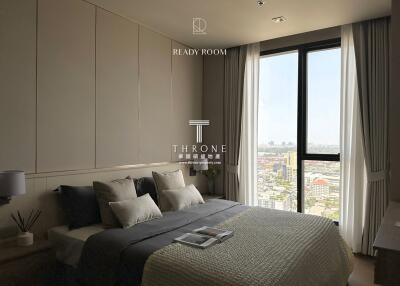 Modern bedroom with large window and city view