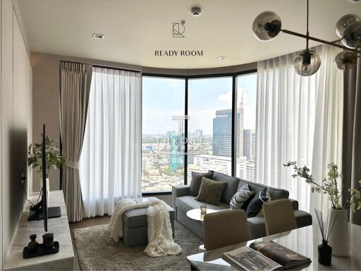 Modern living room with large windows and city view