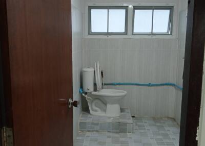 Bathroom with tiled floor and window