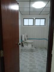 Bathroom with tiled floor and window