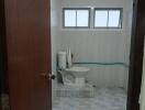 Bathroom with tiled floor and window