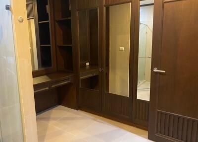 Walk-in Closet with Wooden Cabinets