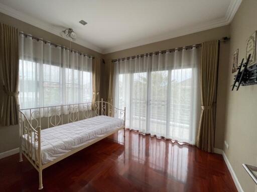 Bright bedroom with daybed and large windows