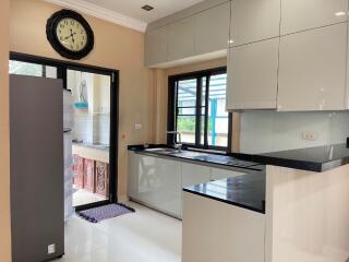 Modern kitchen with sleek cabinets and black countertops